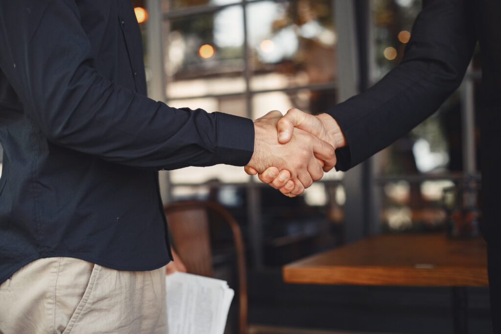 Men shake hands. Enclosure of a business agreement.